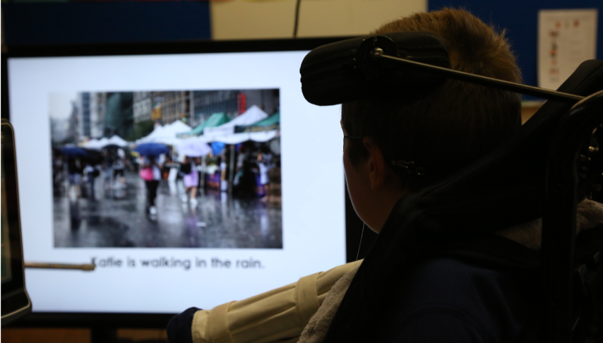 a student reading a book on tar heel reader